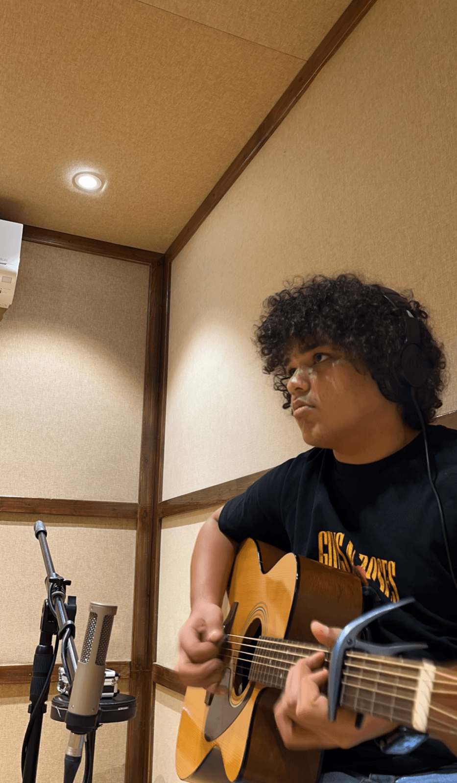 Logus Sethia recording acoustic guitar
